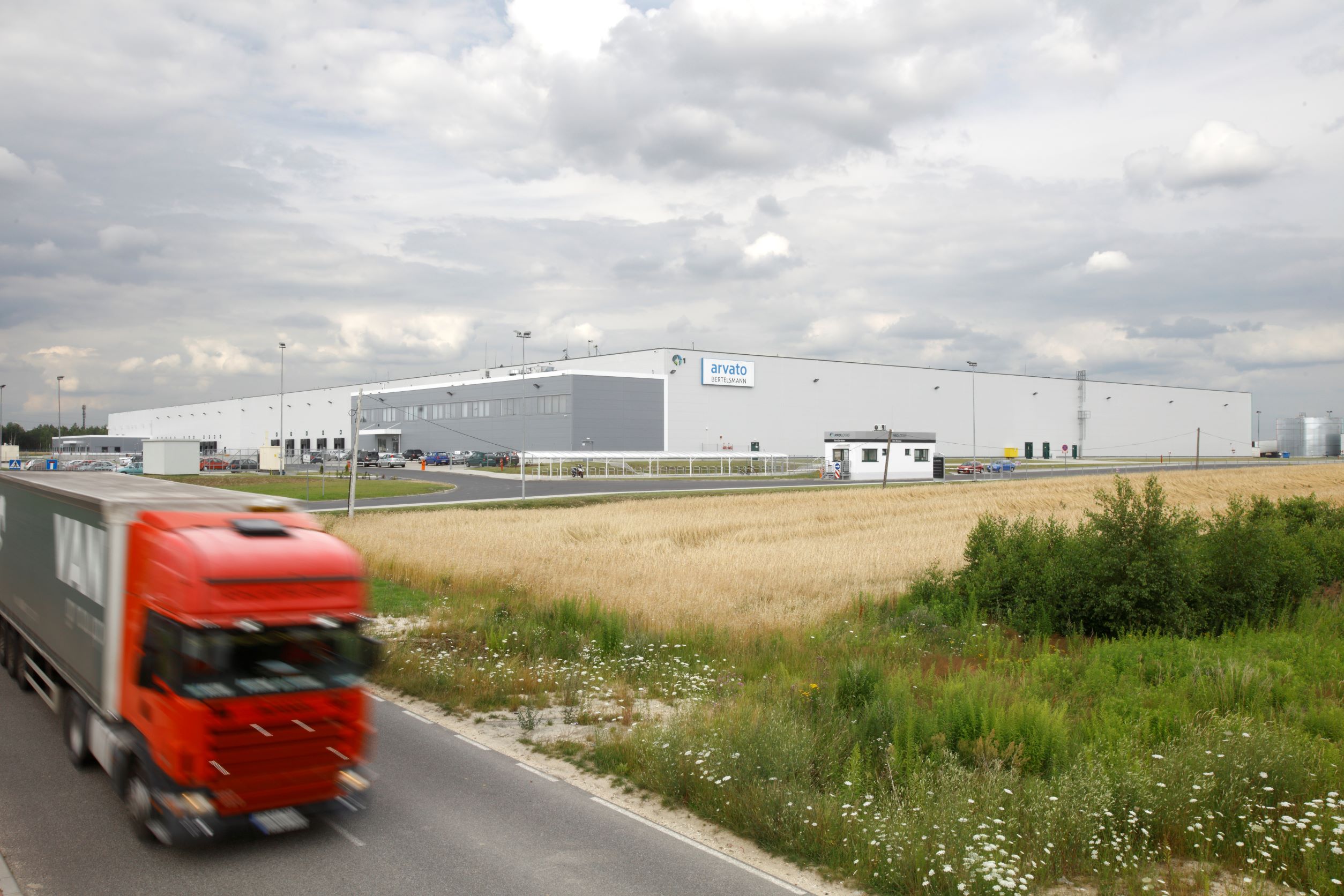 Truck driving on road near Prologis Park Stryków for Arvato