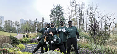 Six team members work outside during IMPACT Day 2020