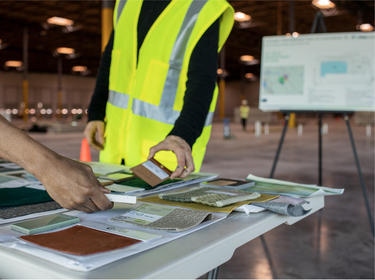 Workers in a warehouse construction project Workers in a warehouse construction project