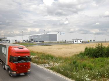 Truck driving on road near Prologis Park Stryków for Arvato