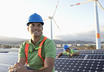 Two people working on solar panels